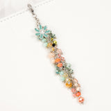 Doodles and Dash Planner Charm with subdued rainbow of crystals and blue enamel flower