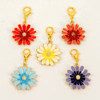 Enamel Daisy flower charms in red, orange, yellow, blue and purple