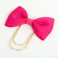 Bright pink bow planner clip with wide gold paper clip
