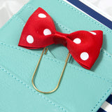 Red and white dotted bow on planner pocket