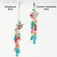 Paper Crane and Blossom Charm shown with two style variations: Ring bound style and traveler's notebook style