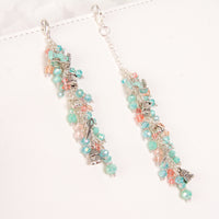 Sewing themed charms with aqua and peach crystal dangle