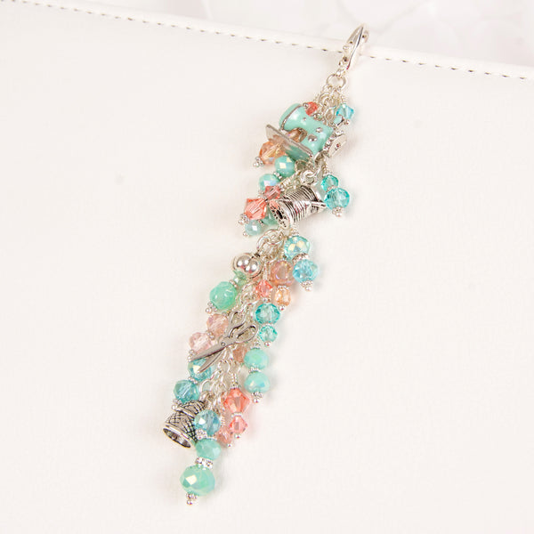Sewing themed dangle charm with aqua and peach crystals
