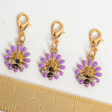 Purple Aster Charm shown with ruler